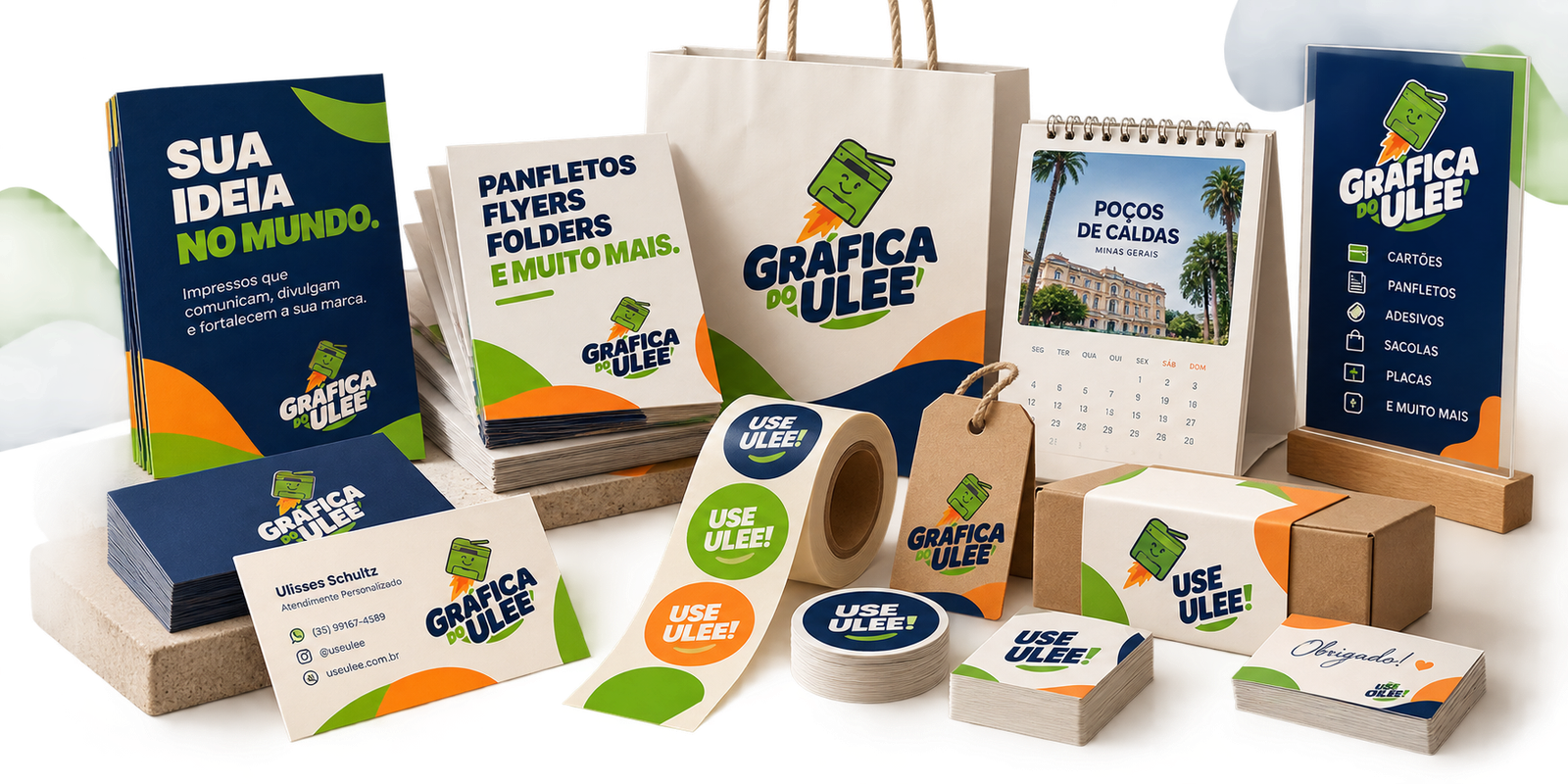 Composição promocional Gráfica do Ulee com cartões, panfletos, sacola, calendário, adesivos e embalagens